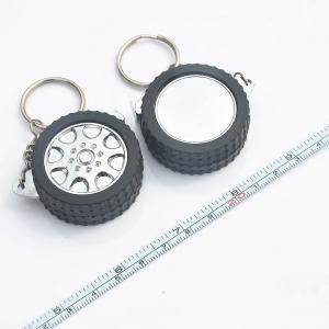 China Tire Shaped Casing Mini Steel Tape Measure Keychain Multifunctional supplier