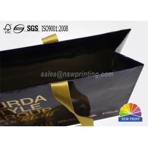 China Glossy Laminated Full Color Printed Custom Paper Garment Bags with Ribbon Handle supplier