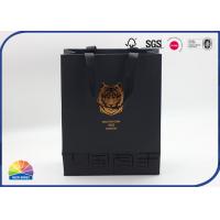 China Black Customized Lion Logo Paper Gift Bag Gold Hot Stamping With Silk Handle on sale