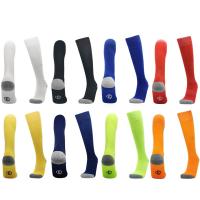 China Solid Color Versatile Men Grip Soccer Socks Polyester Cotton Football Socks Anti Slip on sale