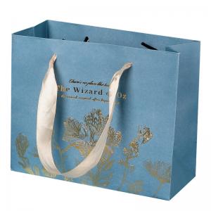 China Shopping Cardboard Clothing Packaging Kraft Paper Bags With Ribbon Handle supplier